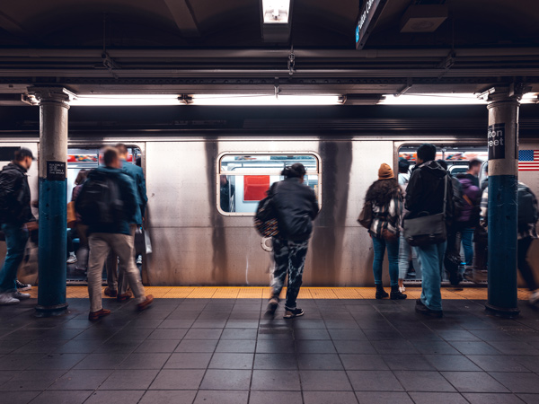 people heading in and out of the train at NYC Subway