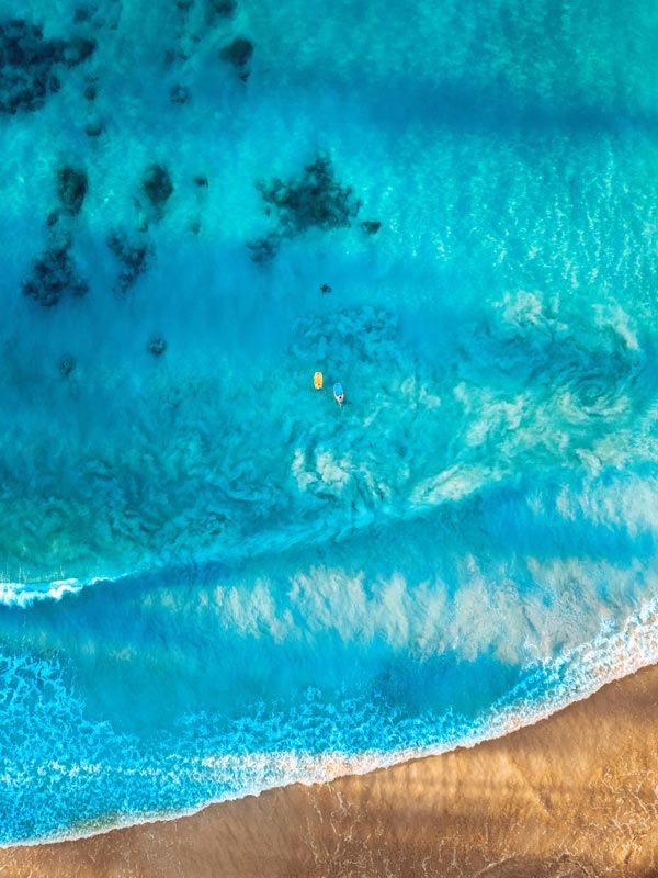Aerial shot of Poipu Beach in Kauaʻi, Hawaiʻi