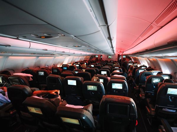 Chairs in aeroplane cabin with some reclined
