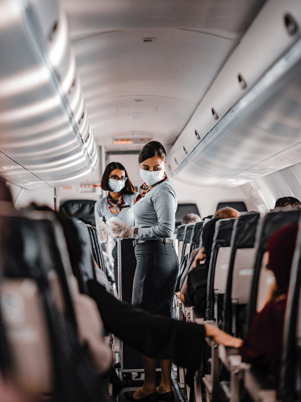 Flight attendants during meal service
