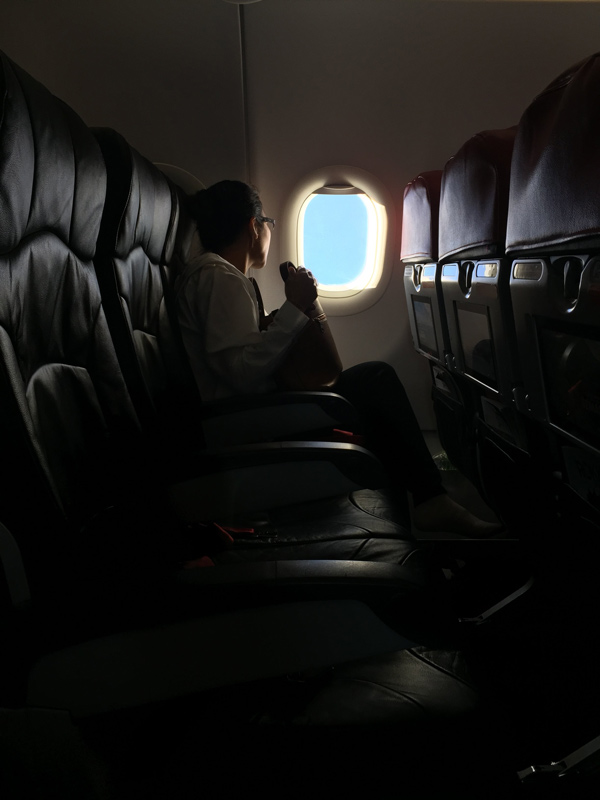 Passenger in own row in aeroplane