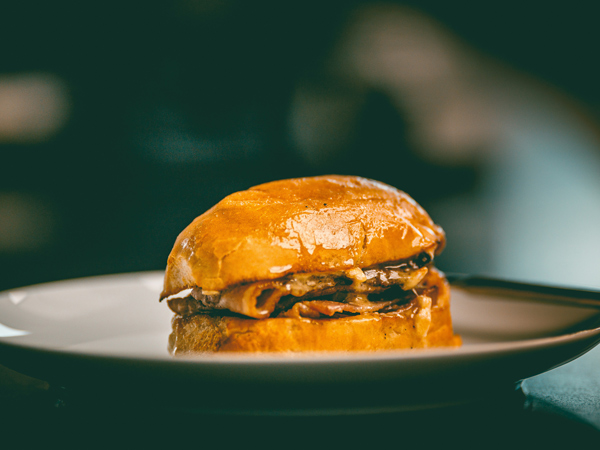 a close-up shot of bacon bap on a plate