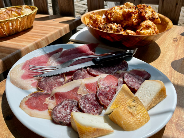 crispy golden beignets de fromage, ham, salami sausage and goat cheese