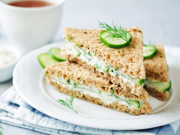 cream cheese cucumber sandwiches on a white plate