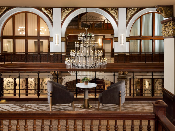 an elegant hotel interior with chandeliers at Union Station Nashville Yards