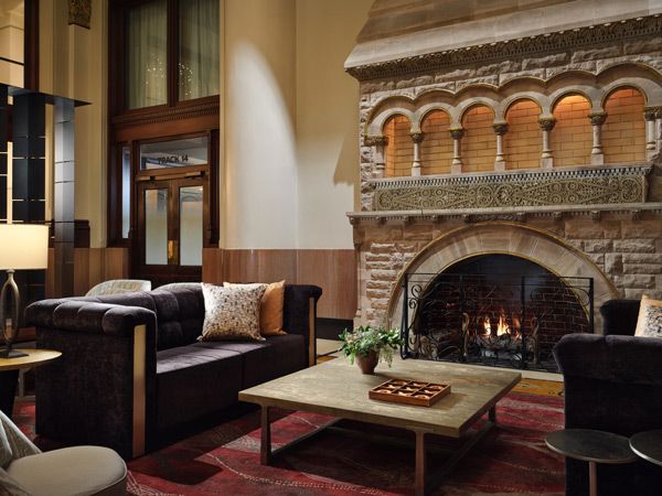 a lobby with fireplace at Union Station Nashville Yards