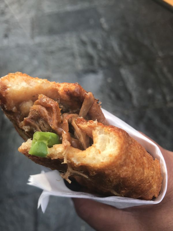 a hand holding a Yorkshire Pudding Wrap