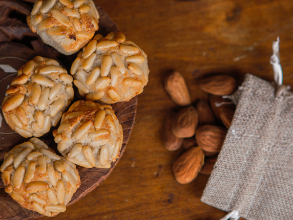 Catalan Panellets with almonds on the wooden table