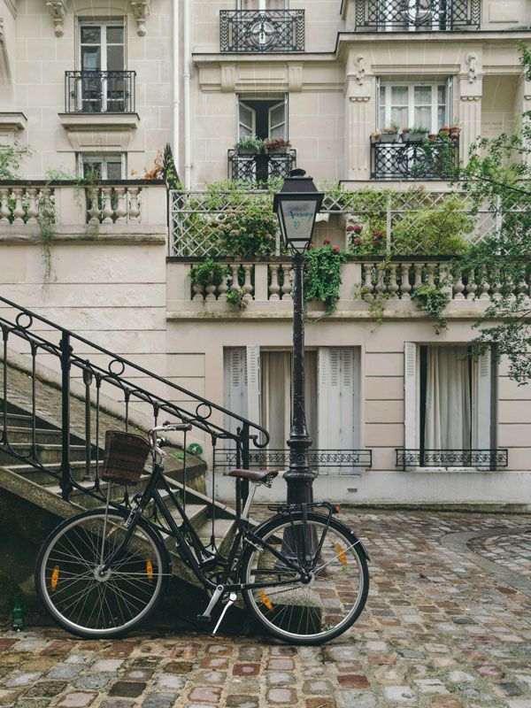 a bicycle on the side of the street in Paris