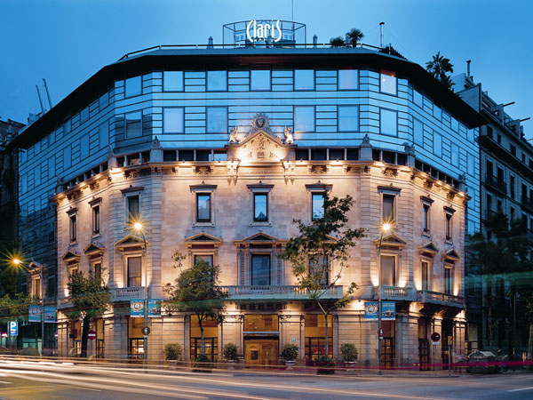 the elegant facade of Hotel Claris Grand Luxe Barcelona