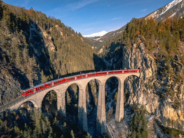 a train passing along the famous Landwasser railway in Switzerland