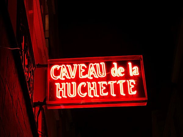 the red signage of Le Caveau de la Huchette