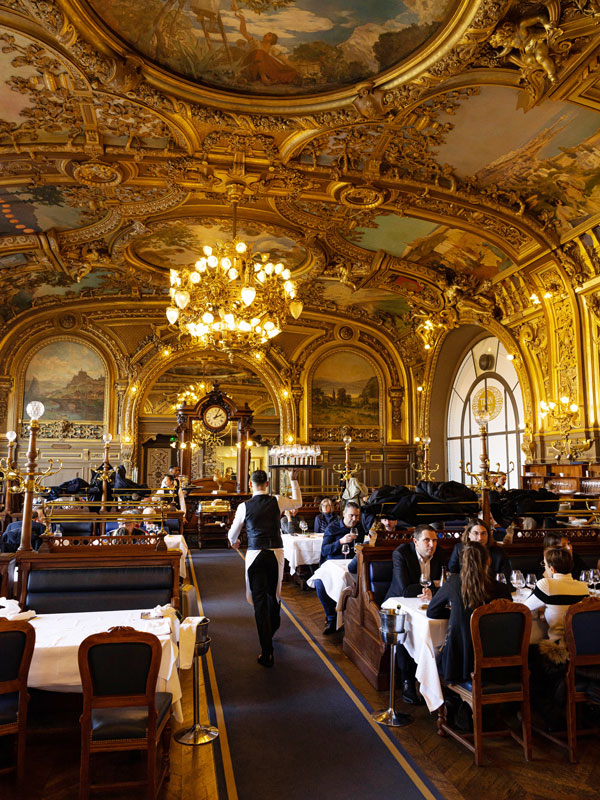 elegant paintings inside Le Train Bleu in Gare de Lyon