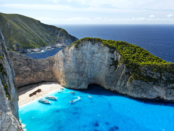 an aerial view of Navagio Beach, Ionian Islands, Greece