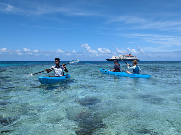 Captain Cook Cruises Fiji's marine biologists kayaking in clear waters