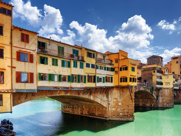 the Ponte Vecchio bridge in Arno River, Florence, Italy