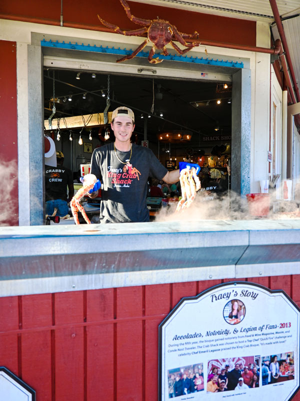 a staff at Tracy's Crab Shack serving fresh local seafood