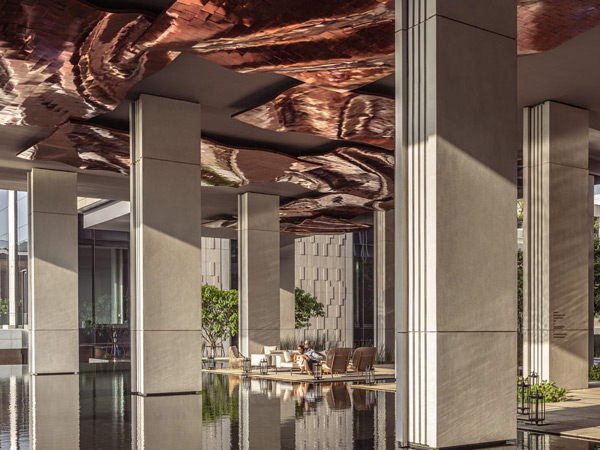 Woman and man in lobby at Four Seasons Bangkok