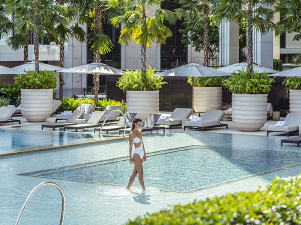 Woman in pool at Four Seasons Bangkok