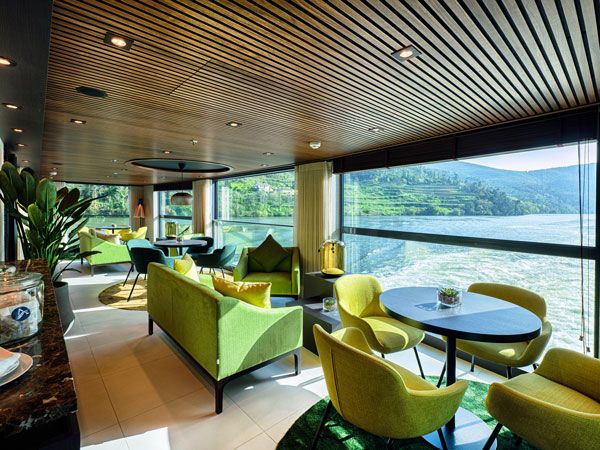 green chairs and tables with panoramic windows at the club lounge, Avalon Alegria