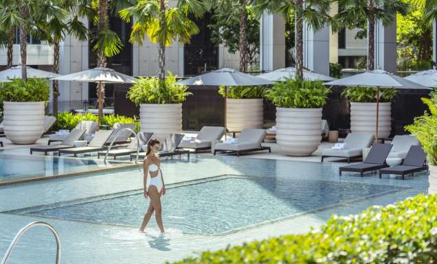 Woman in pool at Four Seasons Bangkok