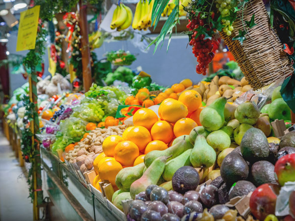 a fruit stall in a mercado in Seville