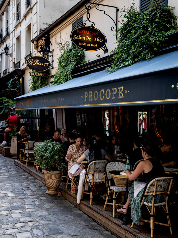 dining outside Procope café in Paris