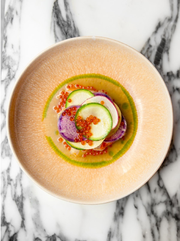 a table-top view of a plated dish at Semilla Paris