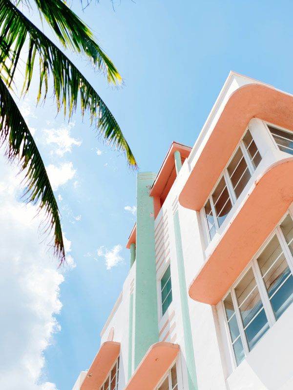 a close-up shot of the top of an Art Deco-inspired building in Miami