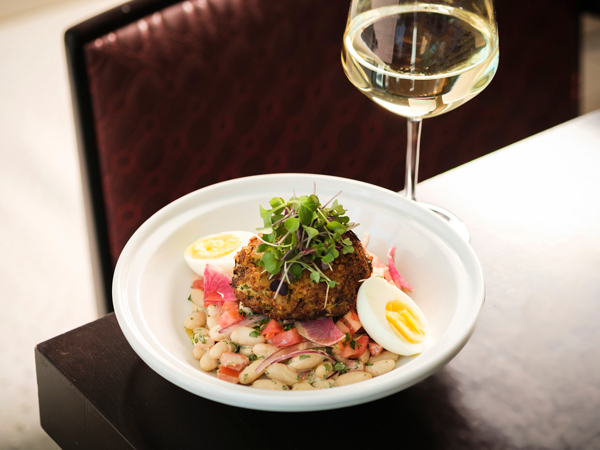 a plate of food with a glass of wine on the table, Area 31 restaurant, Miami