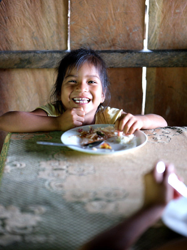 a kid enjoying her breakfast in Bolivar village