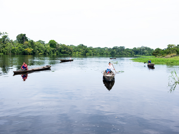 locals paddling through the Amazon River