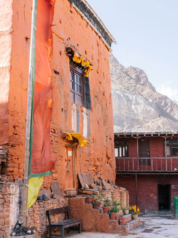 an orange-coloured structure within the community near Shinta Mani Mustang, Nepal