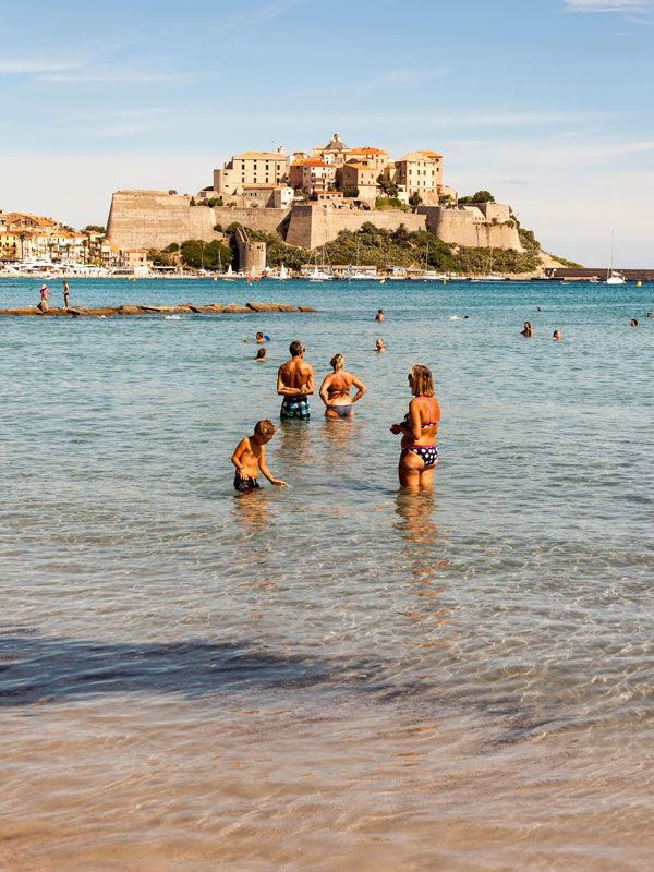 bathers cooling off at Calvi’s 13th-century citadel