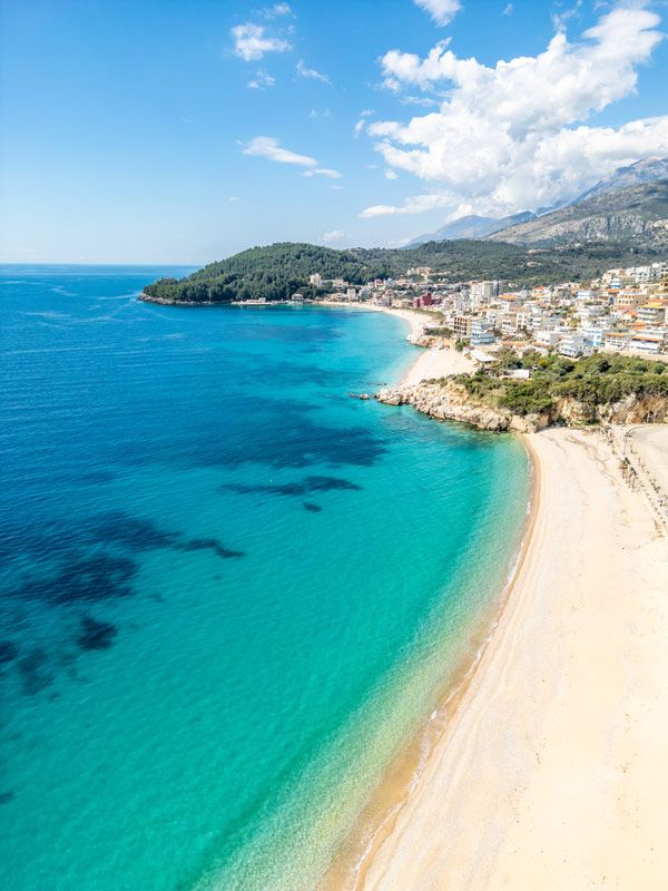 an aerial view of Prinos Beach in Himarë, Albania
