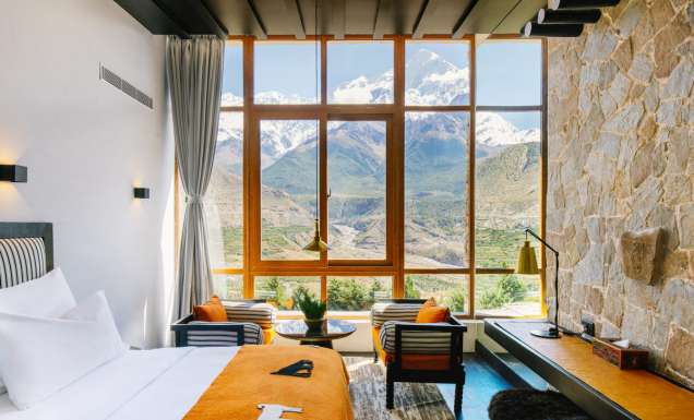 floor-to-ceiling windows frame views of the snow-capped Nilgiri Himal peaks at Shinta Mani Mustang