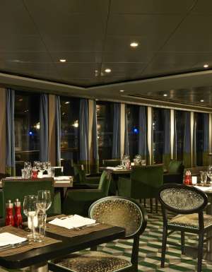 the dimly lit dining setting of Moderno Churrascaria, NCL Norwegian Dawn