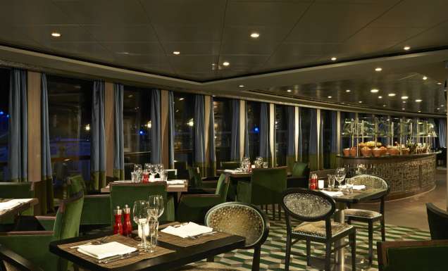 the dimly lit dining setting of Moderno Churrascaria, NCL Norwegian Dawn