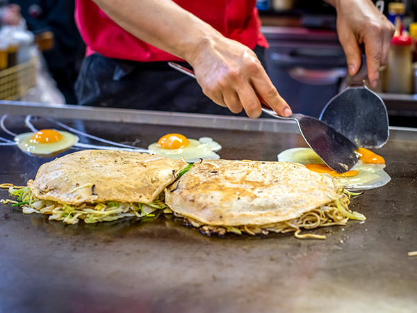 Okonomiyaki - a savory pancake in Hiroshima food in japan