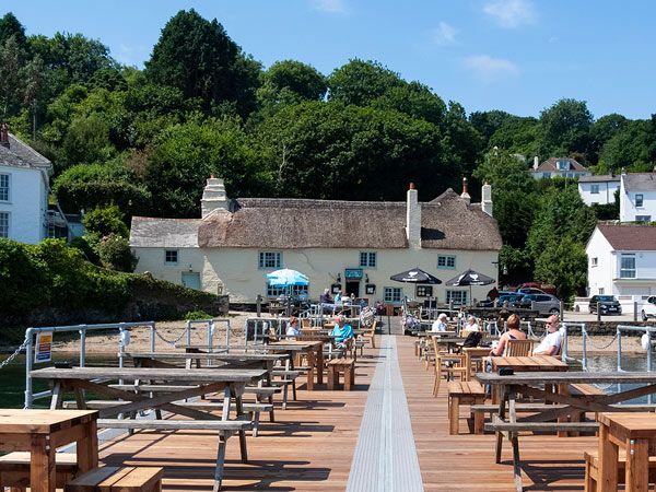 Pandora Inn, Mylor, Cornwall exterior and outdoor seating on the wharf