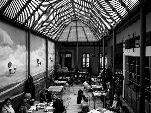 a black and white photo of the dining interior of Prudencia, Bogotá