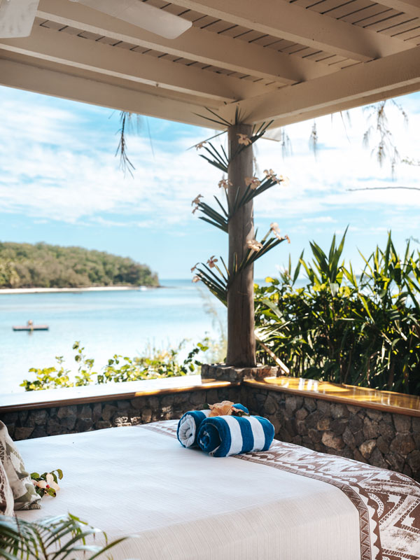 a day bed with a view from the island’s Vonu Point villa