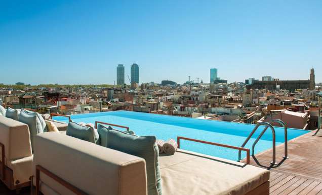 Balinese beds by the rooftop pool at Grand Hotel Central Barcelona