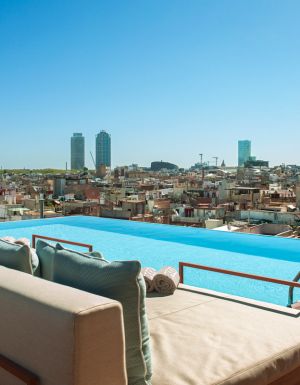 Balinese beds by the rooftop pool at Grand Hotel Central Barcelona