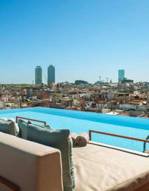 Balinese beds by the rooftop pool at Grand Hotel Central Barcelona