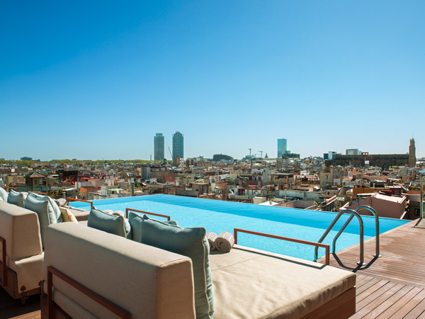 Balinese beds by the rooftop pool at Grand Hotel Central Barcelona