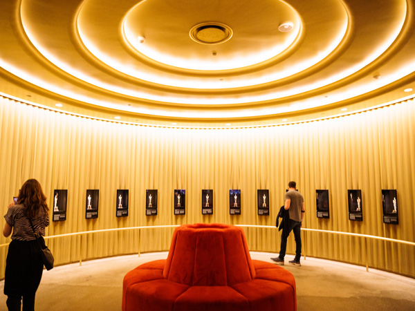 visitors exploring inside The Academy Museum of Motion Pictures