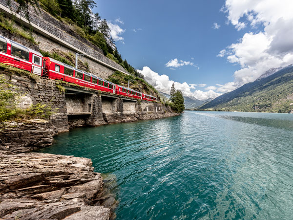 the Bernina Express train passing through a scenic landscape