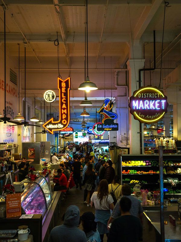 neon signs at the bustling Grand Central Market