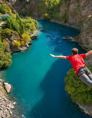 Man doing bungee jump from Kawarau Bridge Bungy in Queenstown, New Zealand